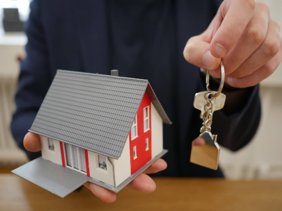 Man holding first home keys